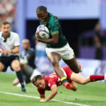 PARIS, FRANCE - JULY 29: Ayanda Malinga #3 of Team South Africa is tackled by Wakaba Hara #11 of Team Japan during the Women's Rugby Sevens Placing 9-12 match between Team Japan and Team South Africa on day three of the Olympic Games Paris 2024 at Stade de France on July 29, 2024 in Paris, France. (Photo by Michael Steele/Getty Images)