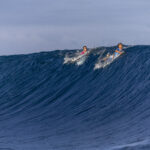 TEAHUPO'O, FRENCH POLYNESIA - JULY 29: (L-R) Griffin Colapinto of Team United States and Kauli Vaast of Team France and paddle during round three of surfing on day three of the Olympic Games Paris 2024 at  on July 29, 2024 in Teahupo'o, French Polynesia. (Photo by Sean M. Haffey/Getty Images)