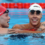 NANTERRE, FRANCE - JULY 29: David Popovici of Team Romania is congratulated by Matthew Richards of Team Great Britain after winning gold in the Men’s 200m Freestyle Final on day three of the Olympic Games Paris 2024 at Paris La Defense Arena on July 29, 2024 in Nanterre, France. (Photo by Adam Pretty/Getty Images)