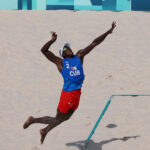 PARIS, FRANCE - JULY 30: Jorge Luis Alayo Moliner of Team Cuba serves during the Women's Preliminary Phase - Pool A match between Team Italy and Team Egypt on day four of the Olympic Games Paris 2024 at Eiffel Tower Stadium on July 30, 2024 in Paris, France. (Photo by Lintao Zhang/Getty Images)