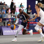 PARIS, FRANCE - JULY 30: Rhyne Howard #10 of Team United States drives to the basket against Team Germany during a Women's Pool Round on day four of the Olympic Games Paris 2024 at Esplanade Des Invalides on July 30, 2024 in Paris, France. (Photo by Lars Baron/Getty Images)