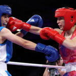 PARIS, FRANCE - JULY 30: Alyssa Mendoza of Team United States punches Mijgona Samadova of Team Tajikistan during the Women's 57kg preliminary round match between Alyssa Mendoza of Team United States and Mijgona Samadova of Team Tajikistan on day four of the Olympic Games Paris 2024 at North Paris Arena on July 30, 2024 in Paris, France. (Photo by Richard Pelham/Getty Images)