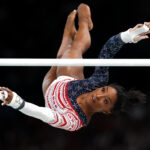 PARIS, FRANCE - JULY 30: Simone Biles of Team United States competes on the uneven bars during the Artistic Gymnastics Women's Team Final on day four of the Olympic Games Paris 2024 at Bercy Arena on July 30, 2024 in Paris, France. (Photo by Jamie Squire/Getty Images)