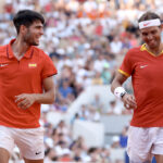 PARIS, FRANCE - JULY 30: Carlos Alcaraz of Team Spain reacts with partner Rafael Nadal of Team Spain against Tallon Griekspoor of Team Netherlands and Wesley Koolhof of Team Netherlands during the Men's Doubles second round match on day four of the Olympic Games Paris 2024 at Roland Garros on July 30, 2024 in Paris, France. (Photo by Clive Brunskill/Getty Images)