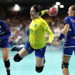 PARIS, FRANCE - JULY 30: Kelly Rosa #77 of Team Brazil shoots at goal during the Women's Preliminary Round - Group B match between the France and Brazil on day four of the Olympic Games Paris 2024 at South Paris Arena on July 30, 2024 in Paris, France. (Photo by Buda Mendes/Getty Images)