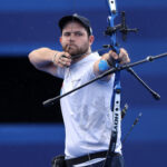 PARIS, FRANCE - AUGUST 01: Pit Klein of Team Luxembourg competes during the Archery Men's Individual 1/32 contest Santiago Arcila of Team Colombia against on day six of the Olympic Games Paris 2024 at Esplanade Des Invalides on August 01, 2024 in Paris, France. (Photo by Julian Finney/Getty Images)