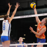 PARIS, FRANCE - AUGUST 01: Jolien Knollema #5 of Team Netherlands attacks the net against Alessia Orro #8 of Team Italy during a Women's Preliminary Round match on day six of the Olympic Games Paris 2024 at Paris Arena on August 01, 2024 in Paris, France. (Photo by Jared C. Tilton/Getty Images)