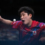 PARIS, FRANCE - AUGUST 01: Tomokazu Harimoto of Team Japan competes during the Table Tennis Men's Singles Quarterfinal match against Zhendong Fan of Team People’s Republic of China on day six of the Olympic Games Paris 2024 at South Paris Arena on August 01, 2024 in Paris, France. (Photo by David Ramos/Getty Images)