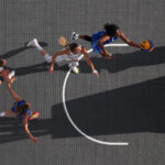 PARIS, FRANCE - AUGUST 01: (EDITORS NOTE: Image was captured using a remote camera positioned above the field of play) Marcedes Walker #45 of Team Azerbaijan shoots over Sonja Greinacher #14 of Team Germany during a women's 3x3 basketball pool round game between Azerbaijan and Germany on day six of the Olympic Games Paris 2024 at Esplanade Des Invalides on August 01, 2024 in Paris, France. (Photo by Elsa/Getty Images)