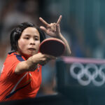 PARIS, FRANCE - AUGUST 01: Song Gyong Pyon of Team Democratic People’s Republic of Korea competes during the Table Tennis Women's Singles Quarterfinal match against Hina Hayata of Team Japan on day six of the Olympic Games Paris 2024 at South Paris Arena on August 01, 2024 in Paris, France. (Photo by Lars Baron/Getty Images)