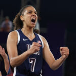 PARIS, FRANCE - AUGUST 01: Cierra Burdick #7 of Team United States reacts during a Women's 3x3 basketball pool round game between the United States and Spain on day six of the Olympic Games Paris 2024 at Esplanade Des Invalides on August 01, 2024 in Paris, France. (Photo by Elsa/Getty Images)