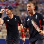 PARIS, FRANCE - AUGUST 01: Andy Murray of Team Great Britain celebrates with partner (out of focus) Daniel Evans of Team Great Britain against Tommy Paul of Team United States and Taylor Fritz of Team United States during the Men's Doubles Quarter-final match on day six of the Olympic Games Paris 2024 at Roland Garros on August 01, 2024 in Paris, France. (Photo by Julian Finney/Getty Images)