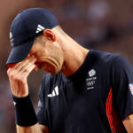 PARIS, FRANCE - AUGUST 01: Andy Murray of Team Great Britain reacts with partner (out of frame) Daniel Evans of Team Great Britain against Tommy Paul of Team United States and Taylor Fritz of Team United States during the Men's Doubles Quarter-final match on day six of the Olympic Games Paris 2024 at Roland Garros on August 01, 2024 in Paris, France. (Photo by Julian Finney/Getty Images)