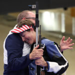 CHATEAUROUX, FRANCE - AUGUST 02: Silver medalist Sagen Maddalena of Team United States celebrates with a team member following the Women's 50m Rifle 3 Positions Final on day seven of the Olympic Games Paris 2024 at Chateauroux Shooting Centre on August 02, 2024 in Chateauroux, France. (Photo by Charles McQuillan/Getty Images)