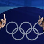 PARIS, FRANCE - AUGUST 02: Tyler Downs and Greg Duncan of Team United States compete in the Men's Synchronised 3m Springboard Final on day seven of the Olympic Games Paris 2024 at Aquatics Centre on August 02, 2024 in Paris, France. (Photo by Quinn Rooney/Getty Images)