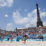 PARIS, FRANCE - AUGUST 02: General view inside the arena as Clemence Vieira of Team France competes as the Eiffel Tower is seen in the background during the Men's Preliminary Phase - Pool B match between Team France and Team Czechia on day seven of the Olympic Games Paris 2024 at Eiffel Tower Stadium on August 02, 2024 in Paris, France. (Photo by Elsa/Getty Images)