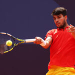 PARIS, FRANCE - AUGUST 02: Carlos Alcaraz of Team Spain plays a forehand during the Tennis Men's Singles Semifinal match against Felix Auger-Aliassime of Team Canada on day seven of the Olympic Games Paris 2024 at Roland Garros on August 02, 2024 in Paris, France. (Photo by Clive Brunskill/Getty Images)