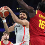 LILLE, FRANCE - AUGUST 02: Jamal Murray #4 of Team Canada grabs a rebound over Usman Garuba #16 of Team Spain during the Men's Group Phase - Group A game between Team Canada and Team Spain on day seven of the Olympic Games Paris 2024 at Stade Pierre Mauroy on August 02, 2024 in Lille, France. (Photo by Gregory Shamus/Getty Images)