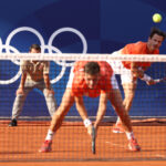 PARIS, FRANCE - AUGUST 02: Wesley Koolhof of Team Netherlands serves as he plays with Demi Schuurs of Team Netherlands during the Tennis Mixed Doubles Bronze Medal match against Gabriela Dabrowski and Felix Auger-Aliassime of Team Team Canada on day seven of the Olympic Games Paris 2024 at Roland Garros on August 02, 2024 in Paris, France. (Photo by Clive Brunskill/Getty Images)