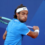 PARIS, FRANCE - AUGUST 02: Lorenzo Musetti of Italy plays a backhand during the Tennis Men's Singles Semifinal match against Novak Djokovic of Serbia on day seven of the Olympic Games Paris 2024 at Roland Garros on August 02, 2024 in Paris, France. (Photo by Clive Brunskill/Getty Images)