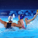 PARIS, FRANCE - AUGUST 02: Ema Vernoux of Team France is challenged by Emily Mary Ausmus of Team United States during the Women's Preliminary Round - Group B match between Team United States and Team France on day seven of the Olympic Games Paris 2024 at Aquatics Centre on August 02, 2024 in Paris, France. (Photo by Clive Rose/Getty Images)