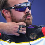 PARIS, FRANCE - AUGUST 02: Florian Unruh of Team Germany competes during the Archery Mixed Quarterfinals match contest against Team Mexico on day seven of the Olympic Games Paris 2024 at Esplanade Des Invalides on August 02, 2024 in Paris, France. (Photo by Alex Pantling/Getty Images)