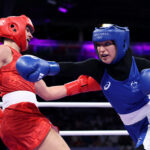 PARIS, FRANCE - AUGUST 02: Julia Szeremeta of Team Poland dodges a punch from Tina Rahimi of Team Australia during the Women's 57kg preliminary round match on day seven of the Olympic Games Paris 2024 at North Paris Arena on August 02, 2024 in Paris, France. (Photo by Ryan Pierse/Getty Images)