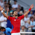 PARIS, FRANCE - AUGUST 02: Novak Djokovic of Team Serbia celebrates match point during the Tennis Men's Singles Semifinal match against Lorenzo Musetti of Team Italy on day seven of the Olympic Games Paris 2024 at Roland Garros on August 02, 2024 in Paris, France. (Photo by Clive Brunskill/Getty Images)