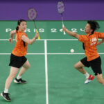 PARIS, FRANCE - AUGUST 02: Yuta Watanabe and Arisa Higashino of Team Japan compete during the Badminton Mixed Doubles Bronze Medal match against Jae Seung Seo and Yu Jung Chae of Team Republic of Korea on day seven of the Olympic Games Paris 2024 at Porte de La Chapelle Arena on August 02, 2024 in Paris, France. (Photo by Julian Finney/Getty Images)