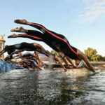 PARIS, FRANCE - AUGUST 8: Competitors dive into the River Seine at the start of the Marathon Swimming Women's 10k on day thirteen of the Olympic Games Paris 2024 at Pont Alexandre III on August 8, 2024 in Paris, France. (Photo by Martin Bureau - Pool/Getty Images)