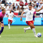 LYON, FRANCE - AUGUST 06: Trinity Rodman #5 of Team United States controls the ball against Giulia Gwinn #15 of Team Germany  during the Women's semifinal match between United States of America and Germany during the Olympic Games Paris 2024 at Stade de Lyon on August 06, 2024 in Lyon, France. (Photo by Claudio Villa/Getty Images)