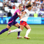 LYON, FRANCE - AUGUST 06: Giulia Gwinn #15 of Team Germany and Sophia Smith #11 of Team United States battle for the ball during the Women's semifinal match between United States of America and Germany during the Olympic Games Paris 2024 at Stade de Lyon on August 06, 2024 in Lyon, France. (Photo by Claudio Villa/Getty Images)