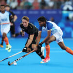 PARIS, FRANCE - AUGUST 06: Raj Kumar Pal of Team India runs with the ball whilst under pressure from Paul-Philipp Kaufmann of Team Germany during the Men's Semi Final match between Germany and India on day eleven of the Olympic Games Paris 2024 at Stade Yves Du Manoir on August 06, 2024 in Paris, France. (Photo by Naomi Baker/Getty Images)