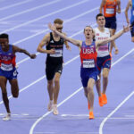 PARIS, FRANCE - AUGUST 06: (L-R)  Bronze medalist Yared Nuguse of Team United States , silver medalist Josh Kerr of Team Great Britain and gold medalist Cole Hocker of Team United States cross the finish line during the Men's 1500m Final on day eleven of the Olympic Games Paris 2024 at Stade de France on August 06, 2024 in Paris, France. (Photo by Steph Chambers/Getty Images)