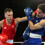 PARIS, FRANCE - AUGUST 06: Lewis Richardson of Team Great Britain punches Marco Alonso Verde Alvarez of Team Mexico during the Men's 71kg Semifinal match on day eleven of the Olympic Games Paris 2024 at Roland Garros on August 06, 2024 in Paris, France. (Photo by Richard Pelham/Getty Images)