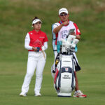 PARIS, FRANCE - AUGUST 07: Miyu Yamashita of Team Japan interacts with her caddie on the third hole during Day One of the Women's Individual Stroke Play on day twelve of the Olympic Games Paris 2024 at Le Golf National on August 07, 2024 in Paris, France. (Photo by Kevin C. Cox/Getty Images)