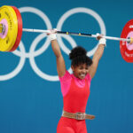 PARIS, FRANCE - AUGUST 07: Rosina Randafiarison of Team Madagascar performs a clean and jerk during the Weightlifting Women's 49kg on day twelve of the Olympic Games Paris 2024 at South Paris Arena on August 07, 2024 in Paris, France. (Photo by Lars Baron/Getty Images)