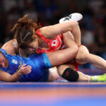 PARIS, FRANCE - AUGUST 07: Yui Susaki of Team Japan (red) and Oksana Livach of Team Ukraine (blue) compete during the Wrestling Women’s Freestyle 50kg Bronze Medal match on day twelve of the Olympic Games Paris 2024 at Champs-de-Mars Arena on August 07, 2024 in Paris, France. (Photo by Sarah Stier/Getty Images)