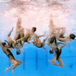 PARIS, FRANCE - AUGUST 07: (EDITORS NOTE: Image was captured using an underwater robotic camera.) Members of Team Japan compete in the Team Acrobatic Routine on day twelve of the Olympic Games Paris 2024 at Aquatics Centre on August 07, 2024 in Paris, France. (Photo by Adam Pretty/Getty Images)