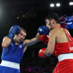 PARIS, FRANCE - AUGUST 07: Oleksandr Khyzhniak of Team Ukraine punches Nurbek Oralbay of Team Kazakhstan during the Boxing Men's 80kg Final match on day twelve of the Olympic Games Paris 2024 at Roland Garros on August 07, 2024 in Paris, France. (Photo by Richard Pelham/Getty Images)