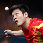 PARIS, FRANCE - AUGUST 08: Fan Zhendong of Team People's Republic of China serves during the Men's Team Semifinal - match 2 between Team People's Republic of China and Team France on day thirteen of the Olympic Games Paris 2024 at South Paris Arena on August 08, 2024 in Paris, France. (Photo by Buda Mendes/Getty Images)