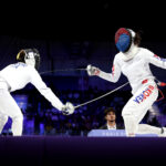 PARIS, FRANCE - AUGUST 08: Assunta Scutto of Team Italy and Seungjun Kim of Team Republic of Korea compete during the Women’s Individual, Fencing Ranking Round on day thirteen of the Olympic Games Paris 2024 at North Paris Arena on August 08, 2024 in Paris, France. (Photo by Elsa/Getty Images)