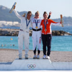 MARSEILLE, FRANCE - AUGUST 08: (L-R) Silver medalist Lauriane Nolot of Team France, Gold medalist Eleanor Aldridge of Team Great Britain and Bronze medalist Annelous Lammerts of Team Netherlands celebrate at the medal ceremony for the Women's Kite on day thirteen of the Olympic Games Paris 2024 at Marseille Marina on August 08, 2024 in Marseille, France. (Photo by Alex Livesey/Getty Images)