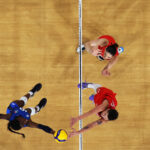 PARIS, FRANCE - AUGUST 08: (EDITORS NOTE: Image was captured using a robotic camera positioned above the field of play.) Paola Ogechi Egonu #18 of Team Italy attacks the net against Ebrar Karakurt #99 of Team Türkiye during a Women's Semifinals match on day thirteen of the Olympic Games Paris 2024 at Paris Arena on August 08, 2024 in Paris, France. (Photo by Lintao Zhang/Getty Images)