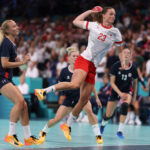 LILLE, FRANCE - AUGUST 08: Kristina Joergensen #23 of Team Denmark shoots the ball past Henny Reistad #25 of Team Norway during the Women's Semifinal match on day thirteen of the Olympic Games Paris 2024 at Stade Pierre Mauroy on August 08, 2024 in Lille, France. (Photo by Alex Davidson/Getty Images)