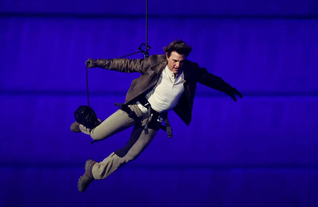 PARIS, FRANCE - AUGUST 11: Actor Tom Cruise jumps from the roof of the Stade de France during the C...