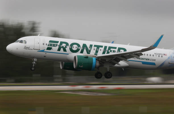 MIAMI, FLORIDA - JUNE 16: A Frontier airlines plane lands at the Miami International Airport on Jun...