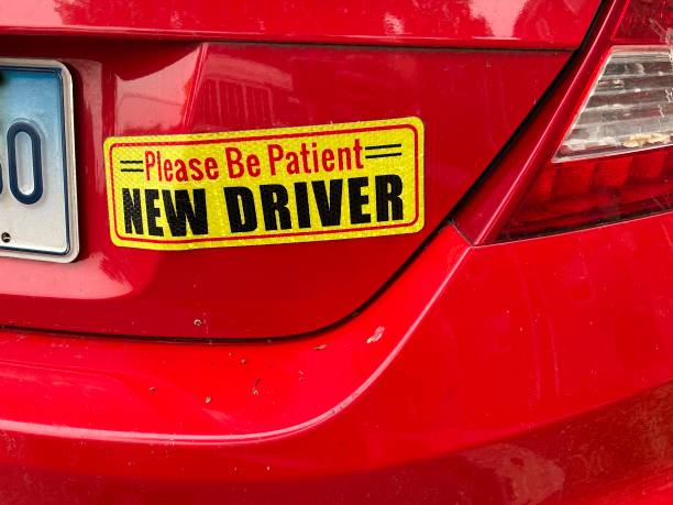 Please be Patient, New Driver bumper sticker on car, Queens, New York. (Photo by: Lindsey Nicholson...