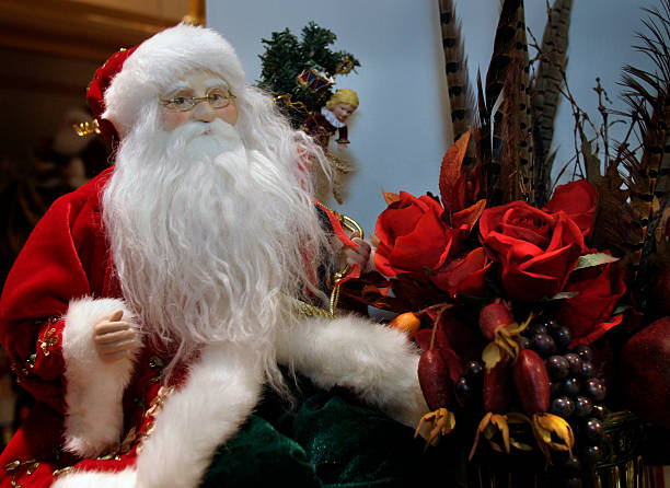 DENVER, COLO. - NOVEMBER 24, 2004 - A small Santa Claus in a holiday display in the Neiman Marcus  ...